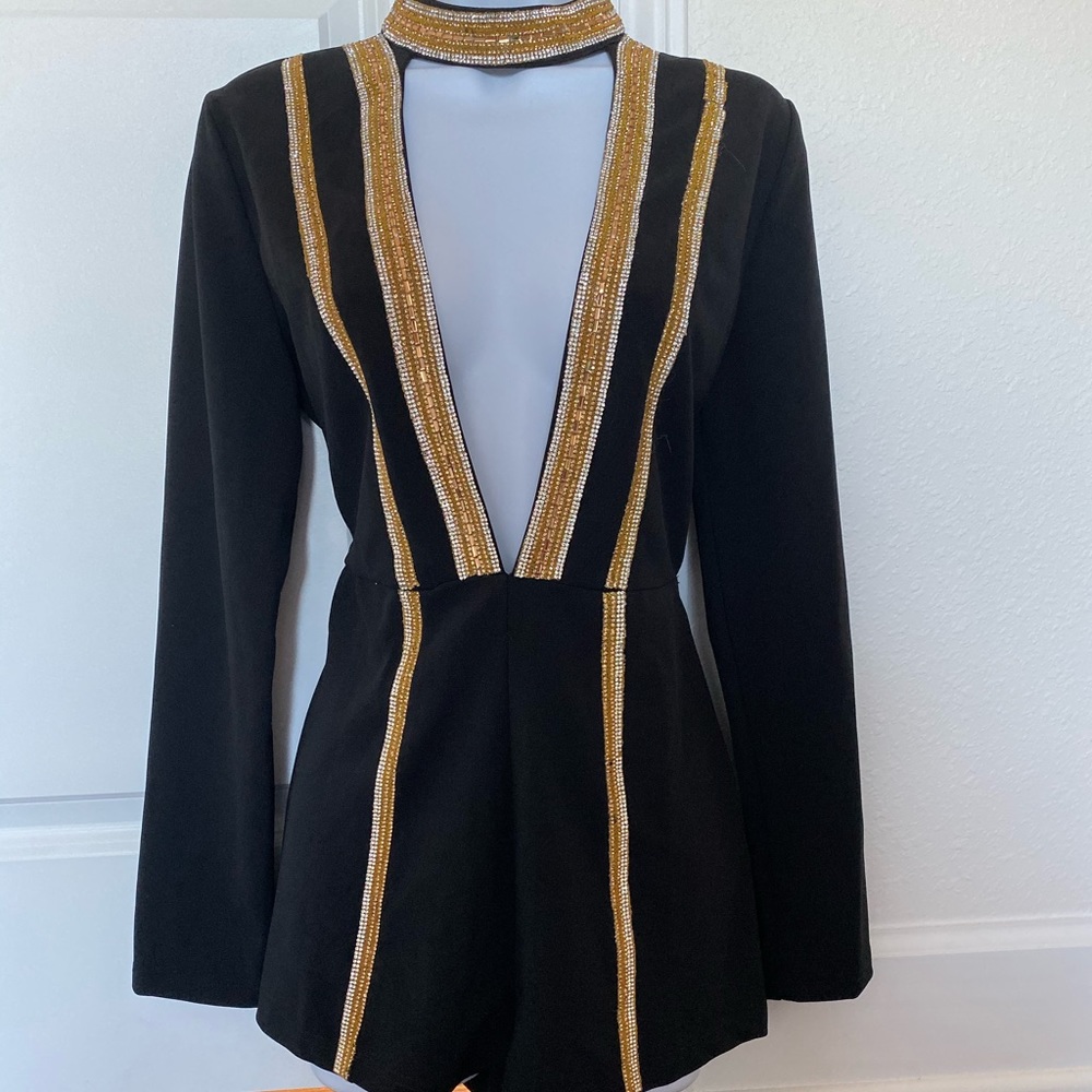 Romper , Black with Gold and silver. From boutique